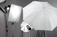 selection of light umbrellas and reflectors